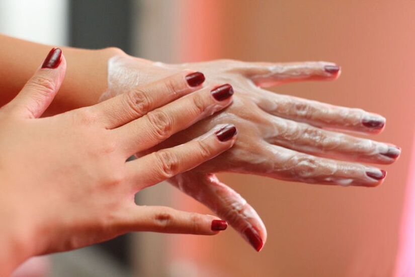 applying cream to hands for skin rejuvenation